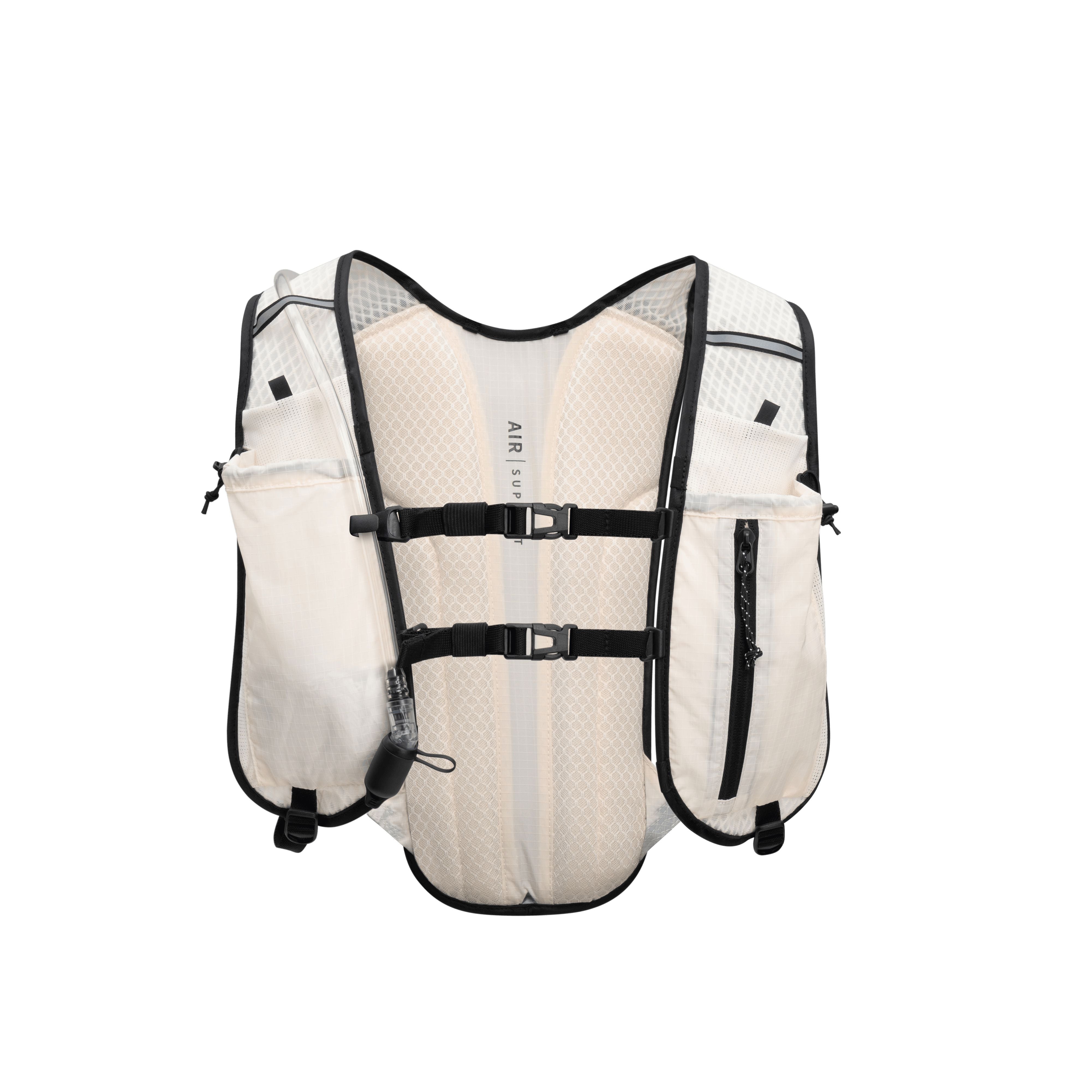 White hydration vest with black straps on a white background
